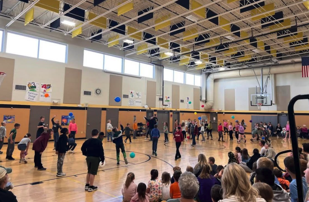 Students playing game at assembly